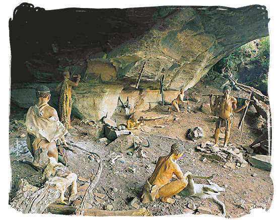 Museum scene of ancient “San” people using the Battle Cave in the beautiful Drakensberg mountains as their shelter - The Khoisan People, Blend of the Khoi and San people in South Africa