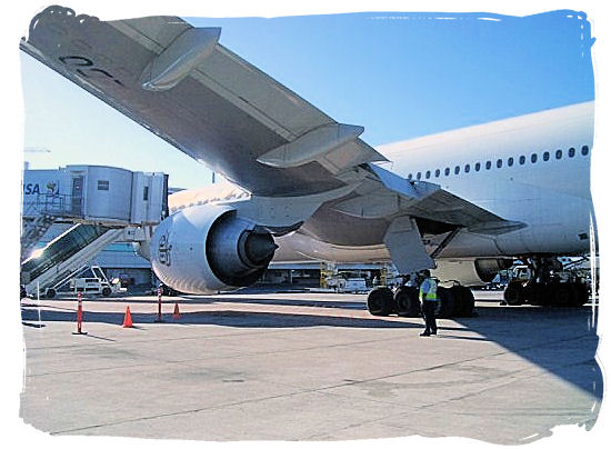 An Emirates Airlines airplane on the platform of Cape Town International Airport - Cheap Flights to Cape Town International Airport South Africa 