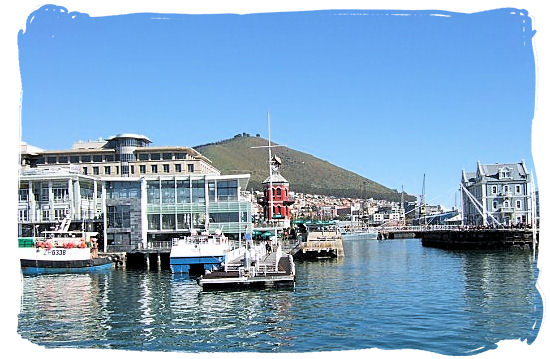 View of the Robben Island Information centre and embarkation jetty from the ferry that has just departed - Victoria & Alfred Waterfront Cape Town, Table Mountain Backdrop