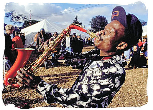 Saxophone player at the Grahams town festival - South African Music, a Fusion of South Africa Music Cultures