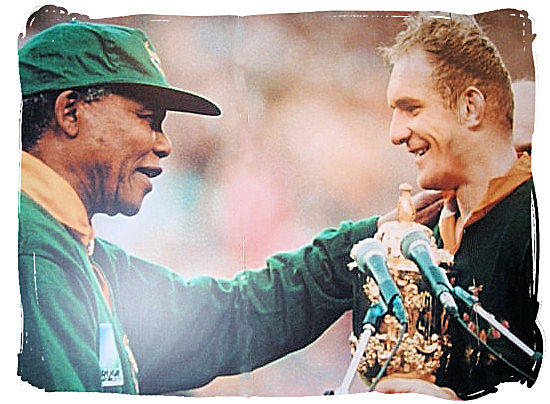 Nelson Mandela congratulating Francois Pienaar, captain of the national Springbok rugby team that won the world rugby championships in 1995.