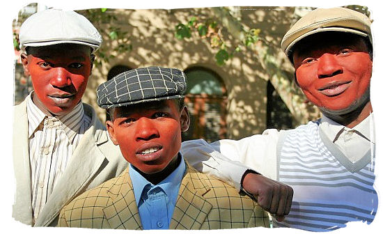 After initiates have passed into manhood, they smear red clay on their faces to celebrate - Xhosa Tribe, Xhosa Language and Xhosa Culture in South Africa