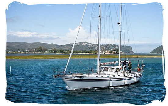 Yachting in the lagoon with the heads showing up in the far distance - Knysna Activities, Attractions and Festivals in South Africa