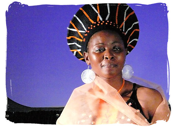 Modern-day young Zulu woman with traditional headdress - The Zulu Tribe and their legendary King Shaka Zulu